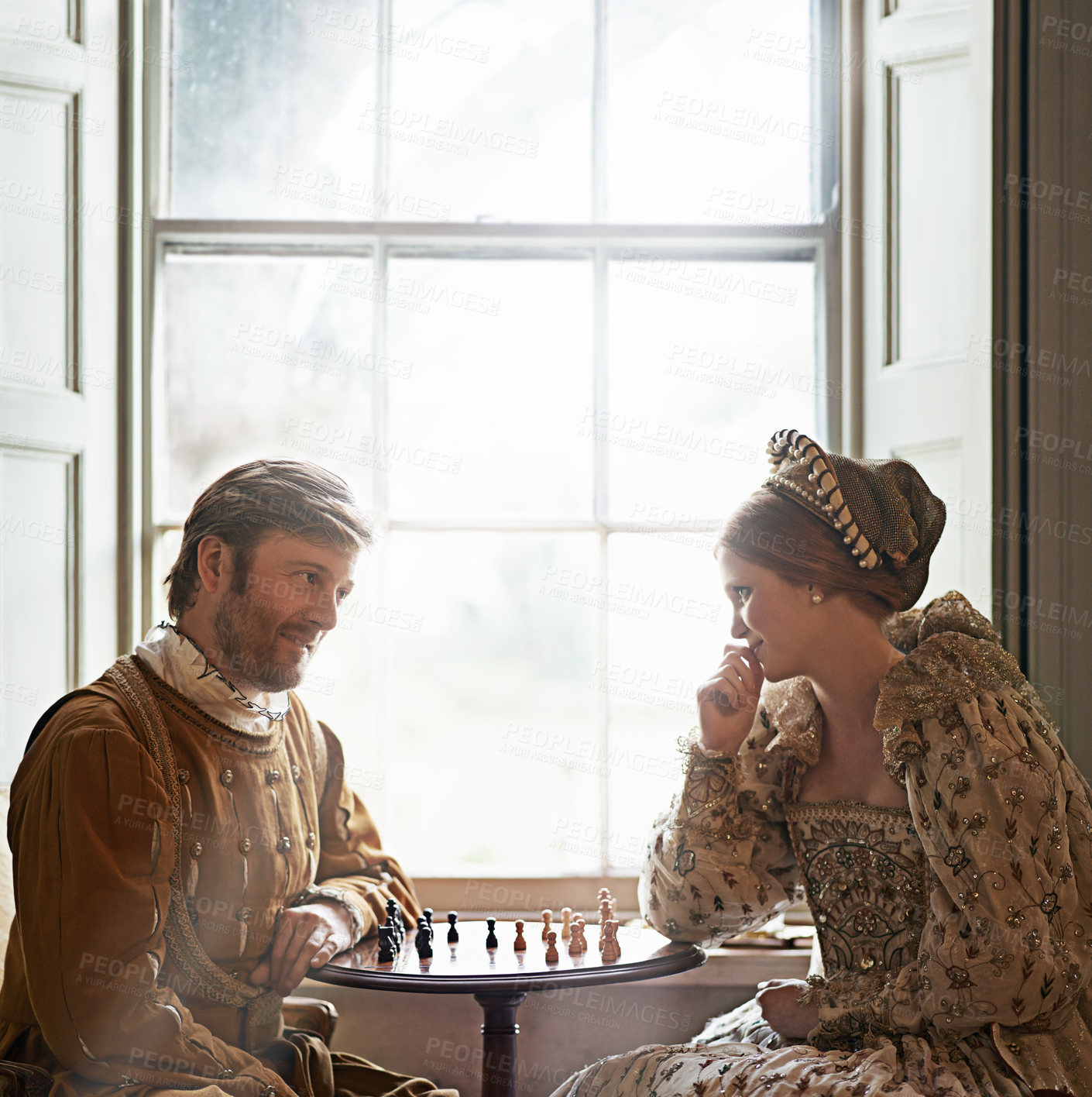 Buy stock photo Shot of a an aristocratic couple playing chess