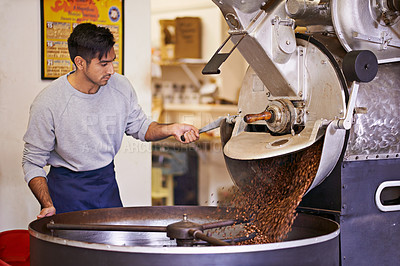 Buy stock photo Coffee beans, process and man with machine for roasting with blending, production and quality control. Entrepreneur, barista or espresso roaster at cafe, sustainable startup shop and small business