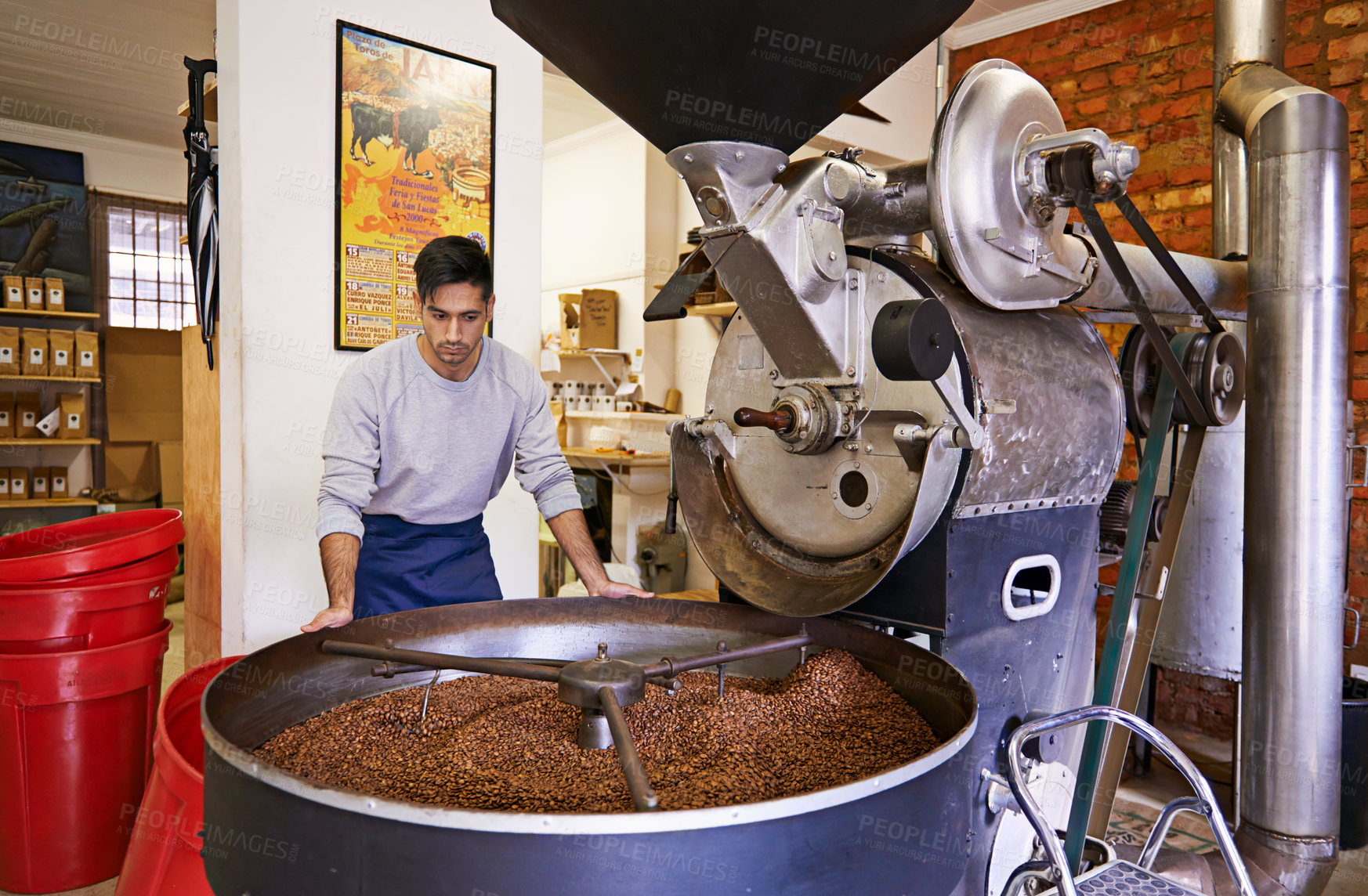 Buy stock photo Coffee, checking and man with machine for roasting with small business, production and quality control. Entrepreneur, barista or roaster with beans at cafe, sustainable startup and espresso process