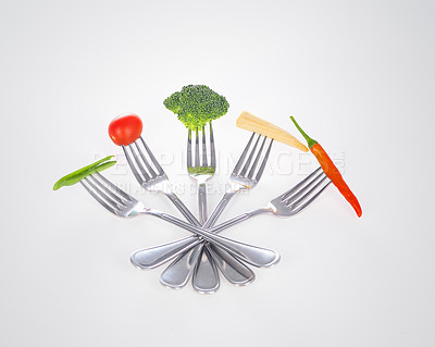 Buy stock photo Fork, vegetables and nutrition with design, wellness and utensils on a white studio background. Food, diet plan and mockup space with kitchen tools and promotion with steel and metal with cutlery