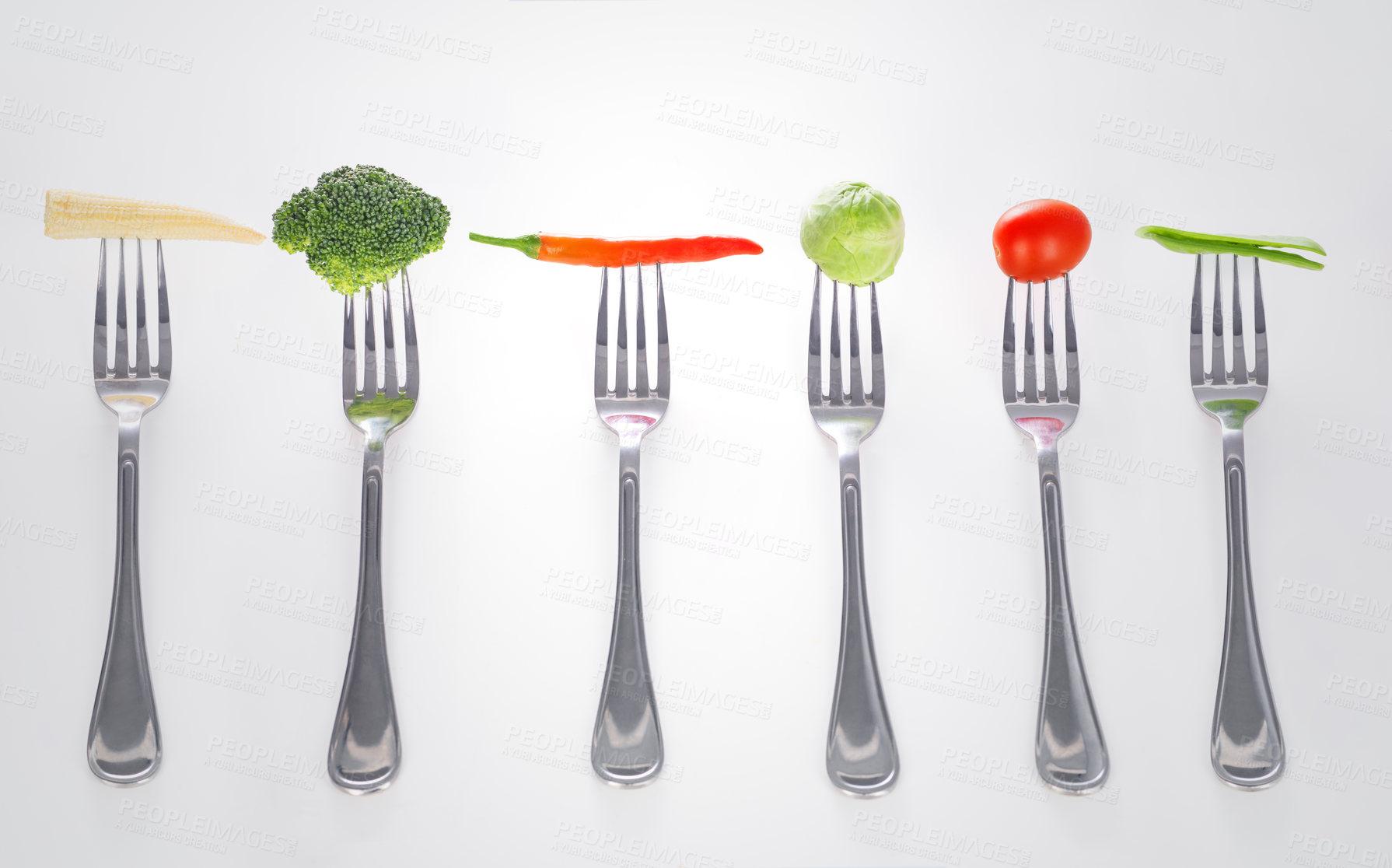 Buy stock photo A series of forks with healthy mouthfuls of vegetables on them