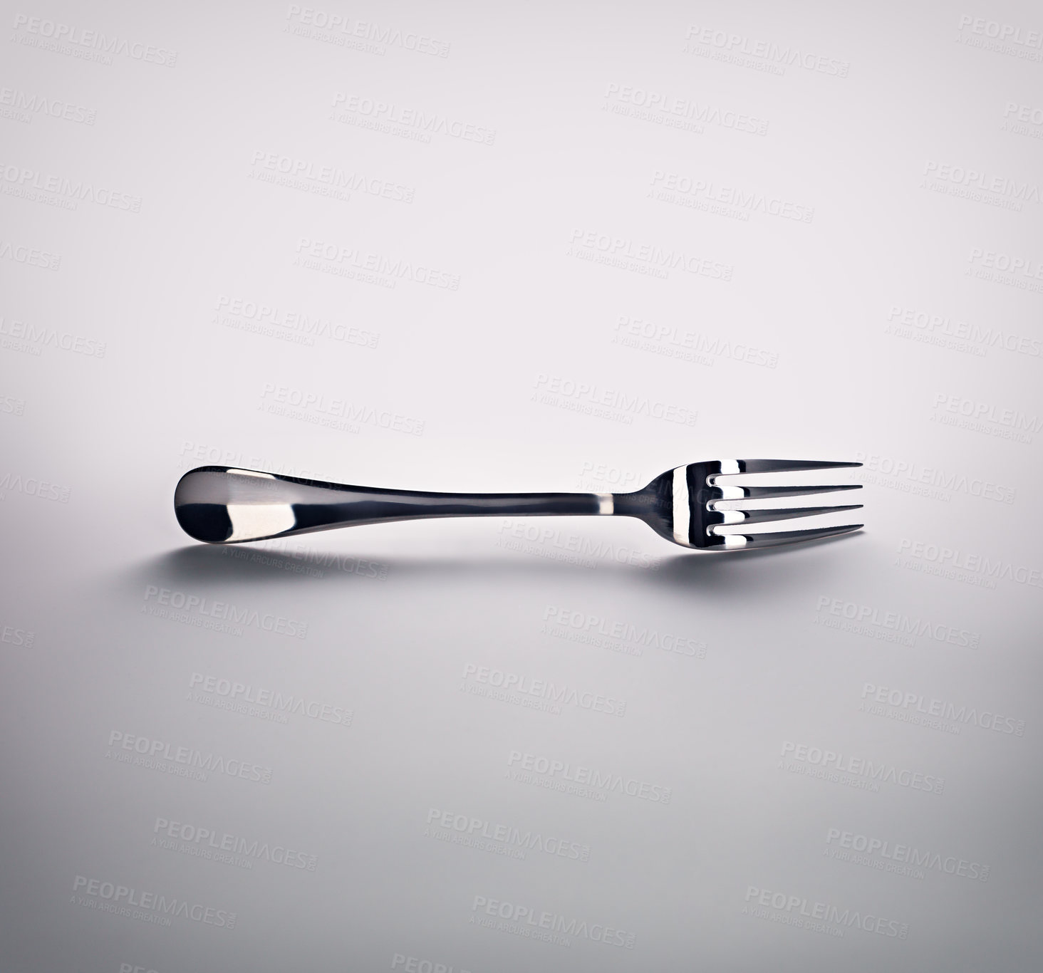 Buy stock photo Studio, clean and fork with reflection or shadow in grey background, shiny and stainless metal. Utensil, silver and cutlery or tableware for eating, restaurant or dinner in kitchen, sharp and object