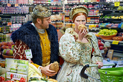 Buy stock photo A view of a king and queen in the supermarket feeling puzzled by the produce