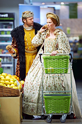 Buy stock photo Confused, supermarket and king with queen, conversation and frustrated with expression and reaction. Royal couple, store and man with woman and decision with inflation and choice with doubt or retail