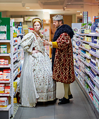 Buy stock photo Store, argument and king with queen, angry and conversation with expression and reaction. Royal couple, man and woman with emotions and frustrated with fighting and supermarket with mistake and fail