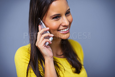 Buy stock photo Woman, phone call and smile in studio with talk for conversation, contact or listen by blue background. Girl, person and model on smartphone, happy and thinking with idea on mobile network in Mexico