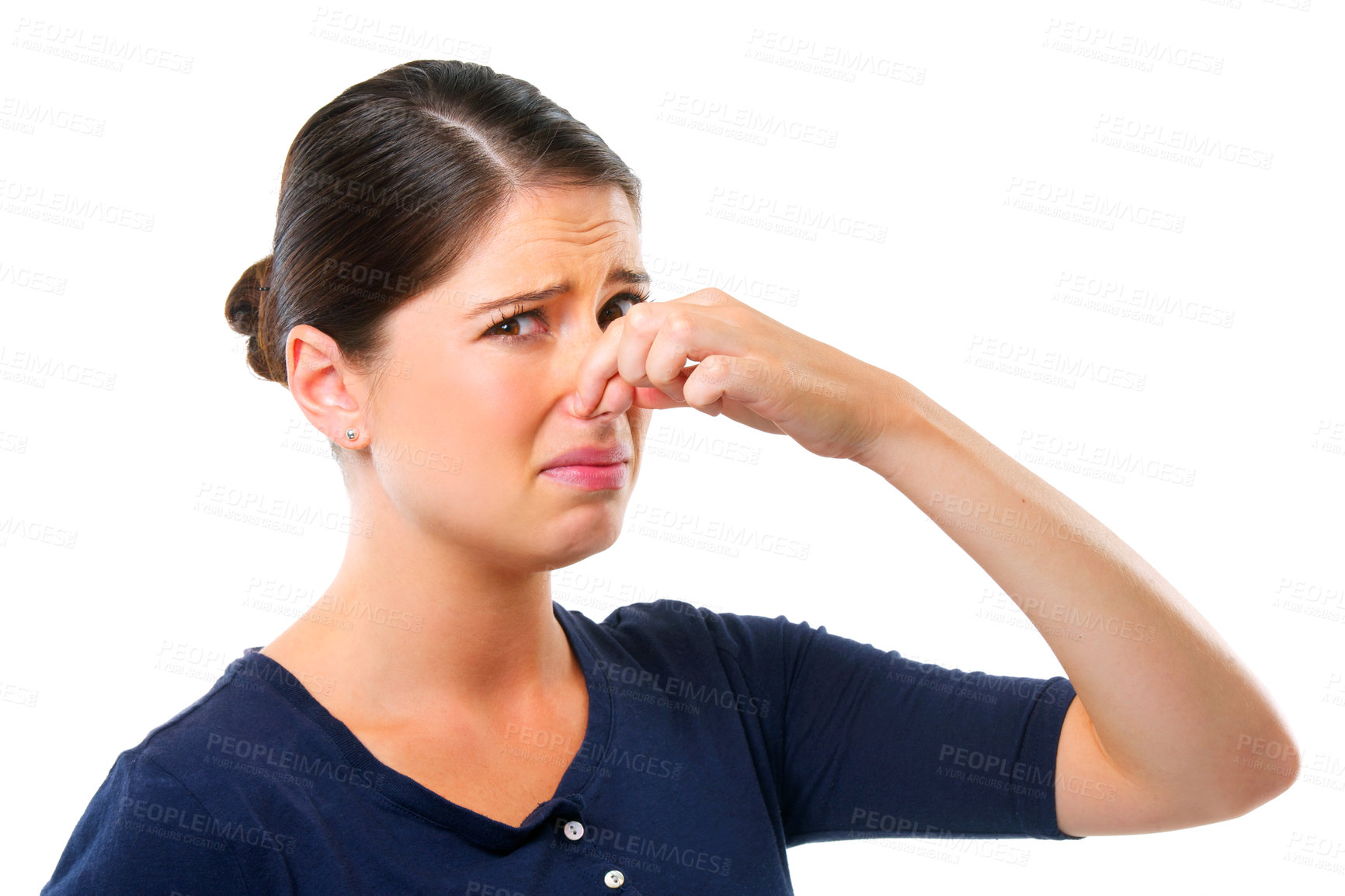 Buy stock photo Studio shot of a young woman holding her nose isolated on white