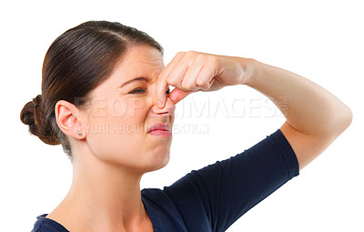 Buy stock photo Smelly, yuck and woman with disgust facial expression for gross, fart and odor on white background and alone. Young person or model and isolated with finger on nose for stink or scent on mockup