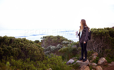 Buy stock photo Woman, hiking and nature with bottle, water and space for mockup with fitness, vision or memory on adventure. Girl, person and hydration in bush, mountains and path for journey by ocean in Cape Town