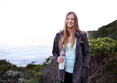 Buy stock photo Woman, hiking and outdoor with bottle, water and space for mockup with fitness, sky or freedom on adventure. Girl, person and hydration in bush, mountains and path for journey with smile in Cape Town