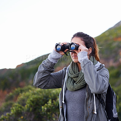 Buy stock photo Woman, hiking and outdoor in nature with binoculars for vision for fitness, location and memory on adventure. Girl, person and trekking in bush, mountains and scenic view on vacation in Cape Town