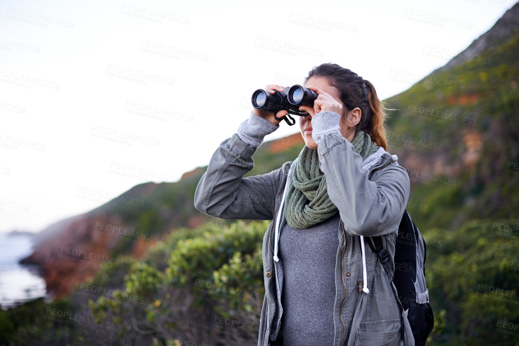 Buy stock photo Woman, binoculars and hiking trip in nature, sightseeing and tool for bird watching in countryside. Trekking, forest and outdoor for wilderness exploration, holiday freedom and eco friendly adventure