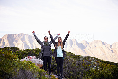 Buy stock photo Portrait of two excited young female hikers in the outdoors