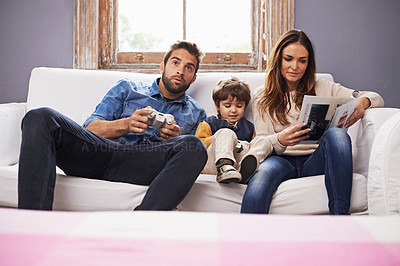 Buy stock photo Family, controller or video game to relax, technology or sofa on metaverse, esports or bonding. Man, mama or child on couch, remote or gaming as excited, virtual or competition or play console