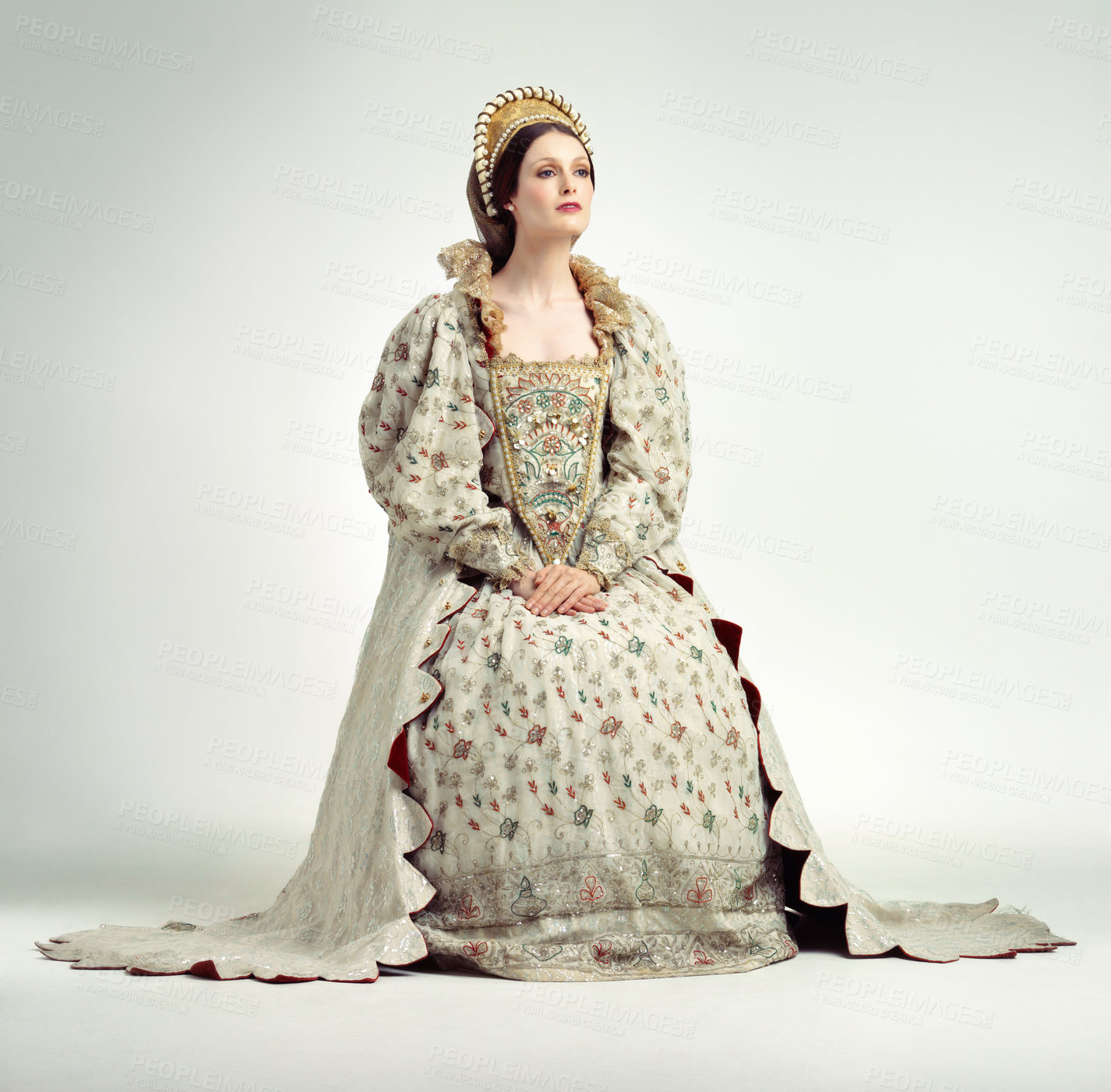 Buy stock photo Queen, crown and vintage with a woman in studio on a gray background as ruler of the monarch during the renaissance period. History, royalty and victorian with an elegant female posing as a leader