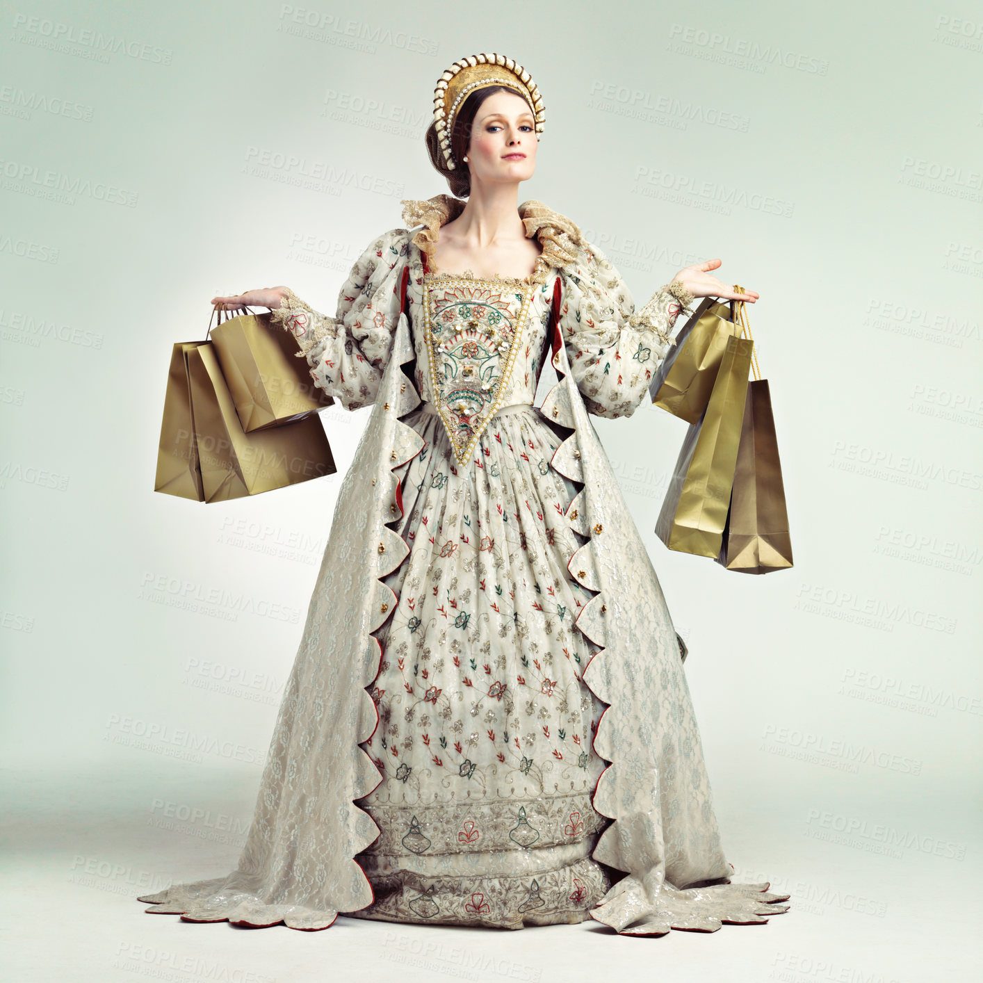 Buy stock photo Portrait, fashion queen and woman with shopping bags in studio isolated on a gray background mockup. Royalty, sales deals and rich and wealthy female ruler holding golden gifts after buying at mall.