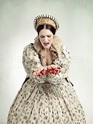 Buy stock photo Studio shot of a queen with blood on her hands