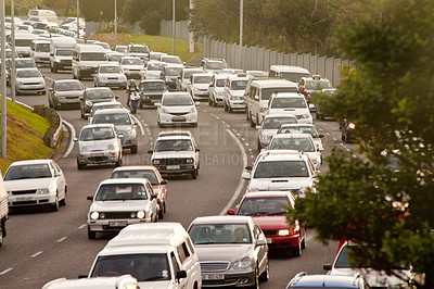 Buy stock photo Shot of a cars traveling in heavy traffic on the way home from work