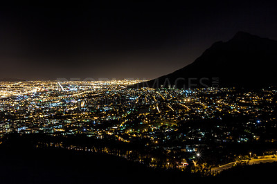 Buy stock photo Night, cityscape and landscape of city lights with architecture from the mountains in South Africa. Earth, environment and dark buildings, development and population from nature in Cape Town