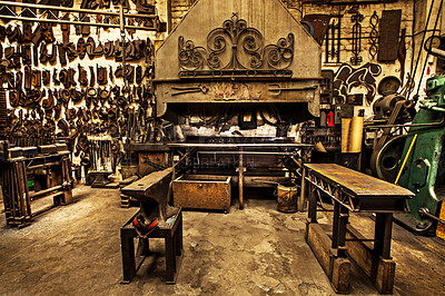 Buy stock photo Shot of a metal craftsman's workshop filled with metal tools