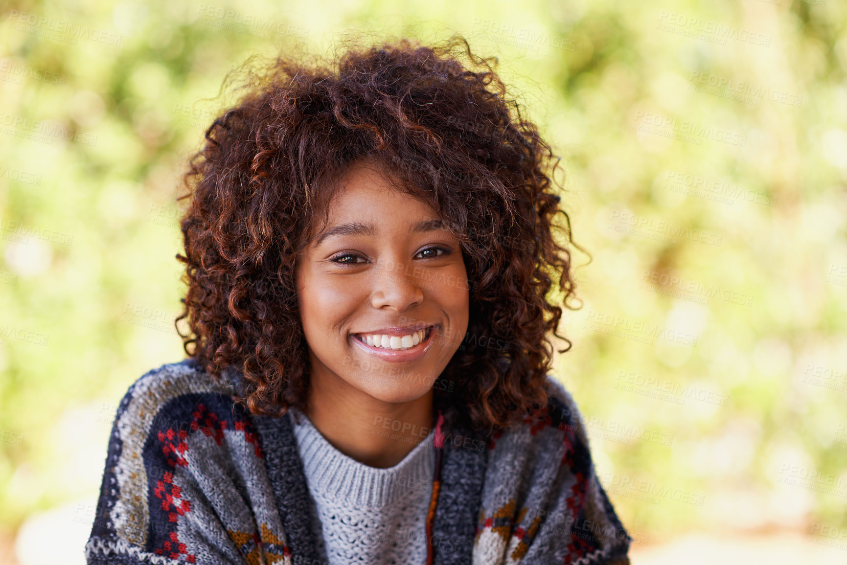 Buy stock photo A radiant young black woman smiling broadly at the camera