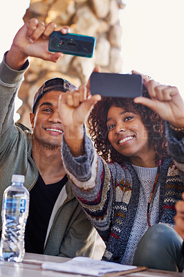 Buy stock photo Students, friends and selfie outdoor on campus for online social media post, connection or bonding. Man, woman and smile at lunch table for together communication with technology, internet or relax