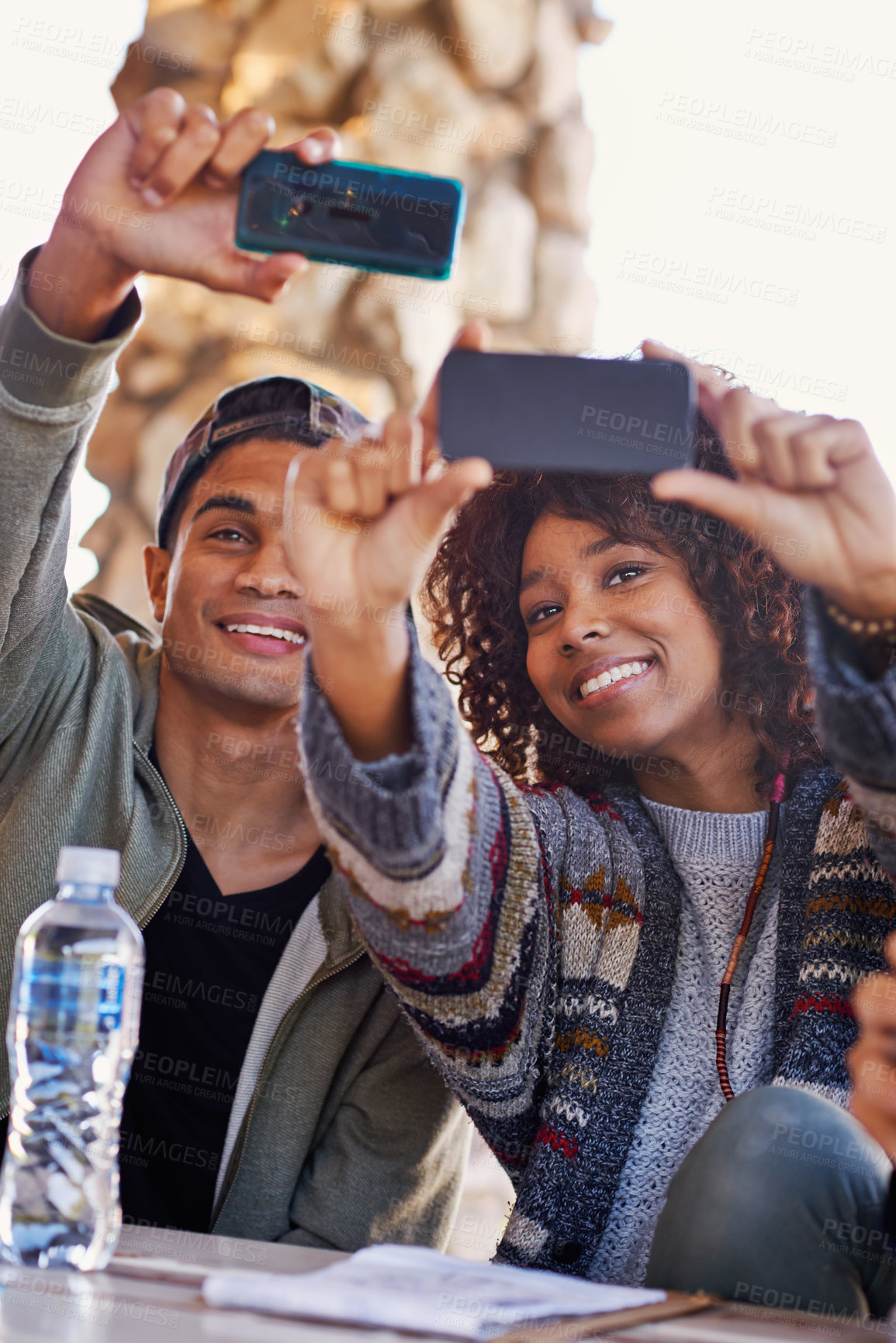 Buy stock photo Students, friends and selfie outdoor on campus for online social media post, connection or bonding. Man, woman and smile at lunch table for together communication with technology, internet or relax