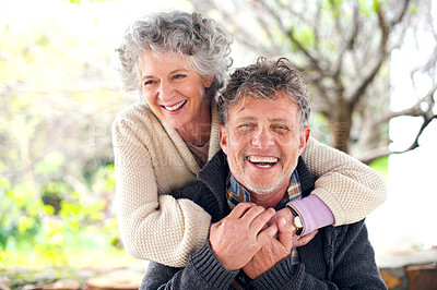 Buy stock photo Portrait of a happily married senior couple bonding outside