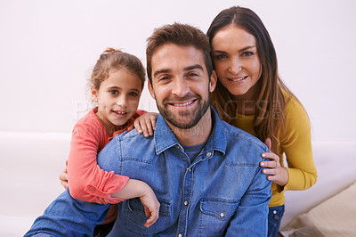 Buy stock photo Family, portrait and home with girl, smile and bonding together with happiness and relaxing with weekend break. Parents, mother and father with daughter and fun childhood with cheerful kid and love