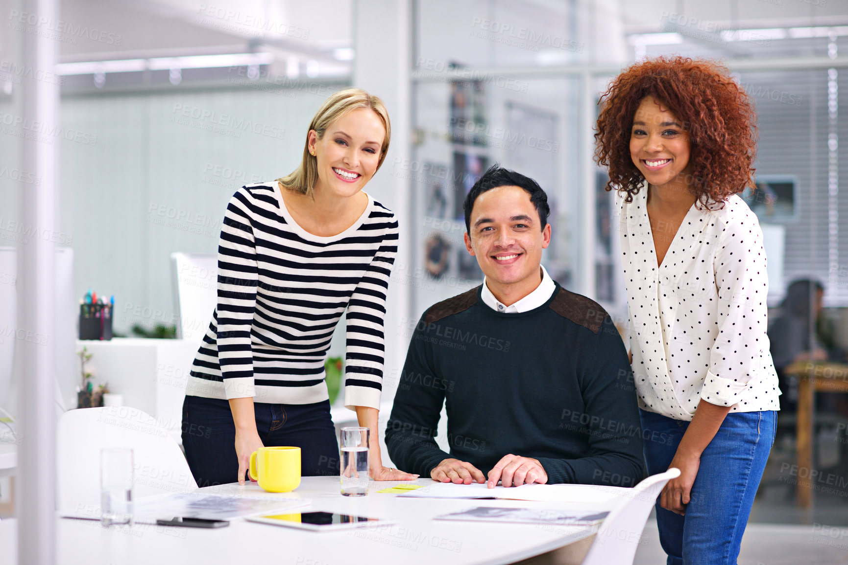 Buy stock photo Shot of a group of young businesspeople at work in an office