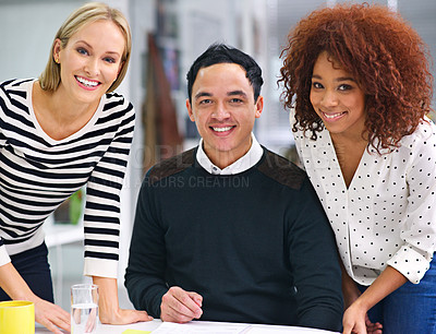 Buy stock photo Shot of a group of young businesspeople at work in an office