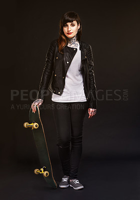 Buy stock photo Fashion, portrait and woman with skateboard in studio for confidence, edgy clothes and satisfaction. Skater, pride and person with tattoos for rebel, grunge style and gen z on black background