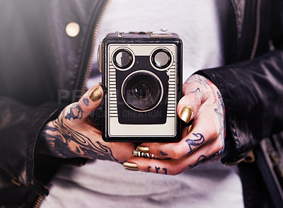 Buy stock photo Person, hands and tattoo with camera for vintage, polish and creative for ink and design for picture and symbol. Art, bold and cool for capture and statement for photographer, trend and edgy 