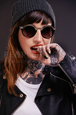 Buy stock photo Sunglasses, tattoo or woman in studio for fashion in leather jacket on black background for edgy style. Dark, bold or cool female punk model with ink for unique art, aesthetic or creative expression 