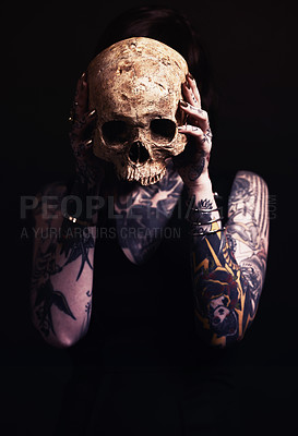 Buy stock photo Skull, bone and woman with tattoo in studio for dark art, abstract horror or scary aesthetic with mask. Creative nightmare, halloween culture and unique person in surreal portrait on black background