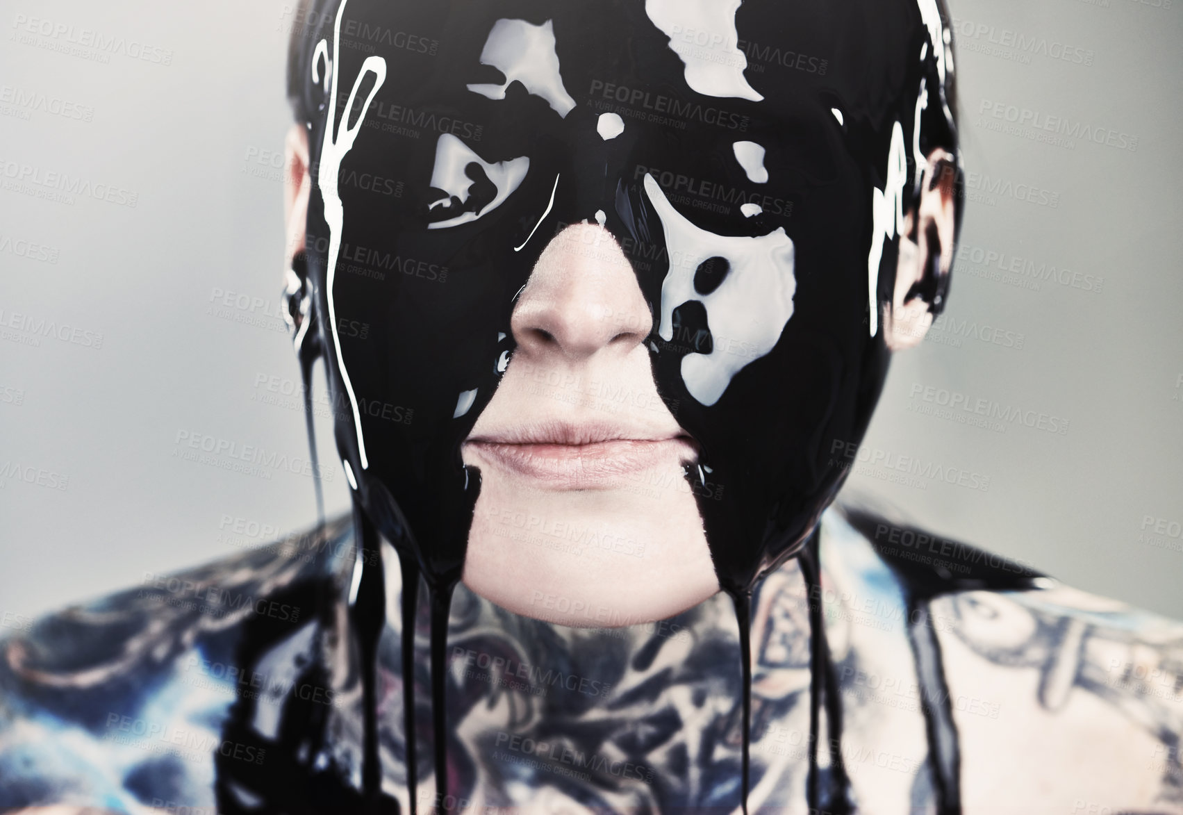 Buy stock photo Paint, ink and face with black liquid for rock, tattoo and punk art in creative career isolated on gray background. Person, artist and closeup for surreal, unique and grunge on studio backdrop