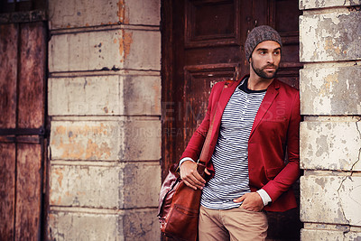 Buy stock photo Man, fashion and model in city with confidence, trendy style or winter accessories with bag outdoor. Urban, unique and stylish with designer clothes, edgy and chic with wool hat or beanie for weather