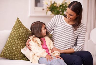 Buy stock photo Living room, mother and daughter talking with smile for embrace in home with love, care and happiness. Apartment, mom and girl in lounge to relax on sofa or couch with hug for bonding in family house