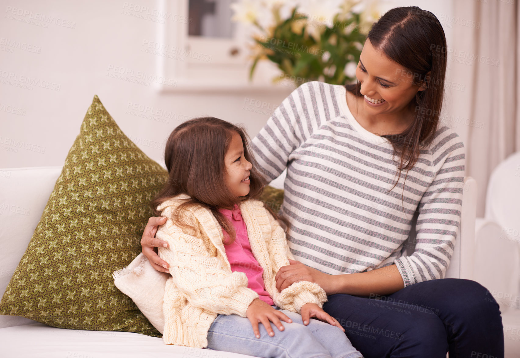 Buy stock photo Living room, mother and daughter talking with smile for embrace in home with love, care and happiness. Apartment, mom and girl in lounge to relax on sofa or couch with hug for bonding in family house