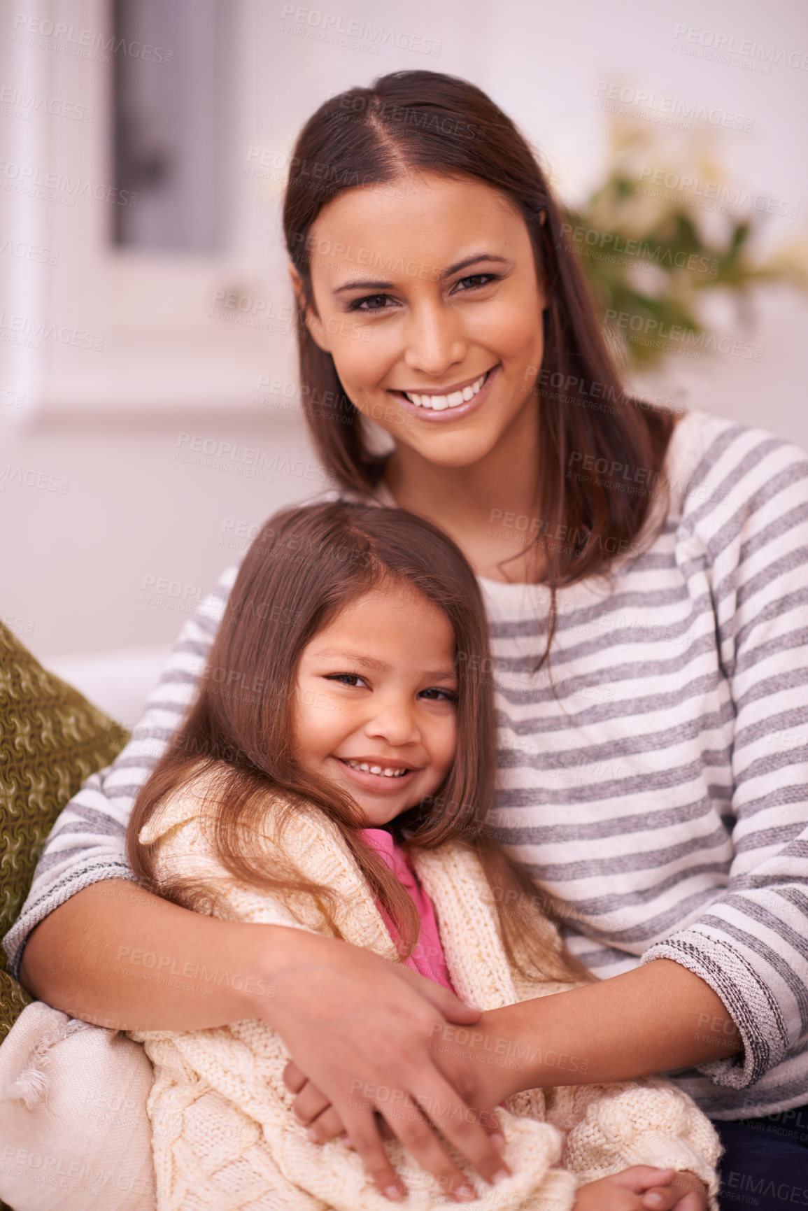 Buy stock photo Living room, mom and daughter with hug for love in home with smile, care and happiness. Apartment, woman and girl  together for bonding in lounge to relax on couch or sofa for mother's day in weekend