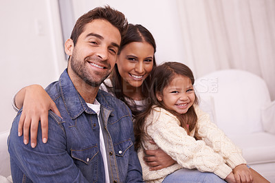 Buy stock photo Home, sofa and portrait of family with smile for bonding, support and childhood development. Happy, father and mother with daughter for holiday enjoyment, love and relaxing together in living room