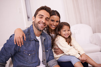 Buy stock photo Living room, sofa and portrait of family with smile for love, support and relaxing together. Happy, father and mother with daughter for holiday enjoyment, bonding and childhood development at home