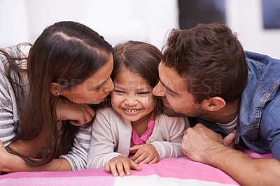Buy stock photo Kiss, family or child in bed, love or hug as memory of happiness, bonding or together in home. Parents, girl or cheek to relax, care or embrace as playful, parenting or childhood on joyful holiday