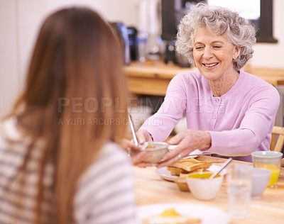 Buy stock photo Breakfast, senior and mother with food on dining table for eating with smile for healthy meal and diet. Adult, woman and elderly female person with visit from grandchild for Easter holiday in home