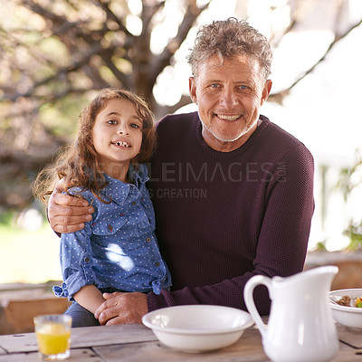 Buy stock photo Grandfather, child and portrait hug on table with breakfast for family, love and relationship in summer. Man, grandchild and embrace on patio with connection at lunch, nutrition and wellness together