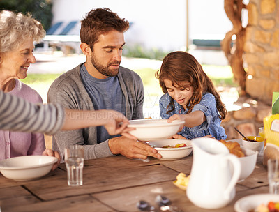 Buy stock photo Family, father and daughter at breakfast with serve for nutrition, bonding and eating together with grandma. People, healthy food and relax at dining table in the garden for wellness and meal in home
