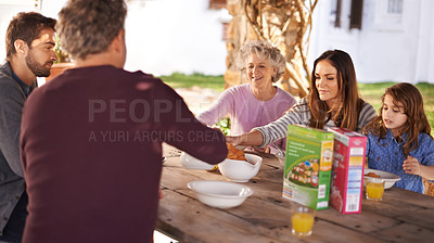 Buy stock photo Happy family, eating and breakfast in garden of home for nutrition, bonding and relax together with porridge. Parents, grandparents and child with healthy diet and meal at dining table in the morning
