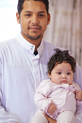 Buy stock photo Muslim, home and portrait of father with baby for bonding, ramadan and calm together. Parenting, happy family and Islamic dad with newborn infant for love, childcare or support in living room