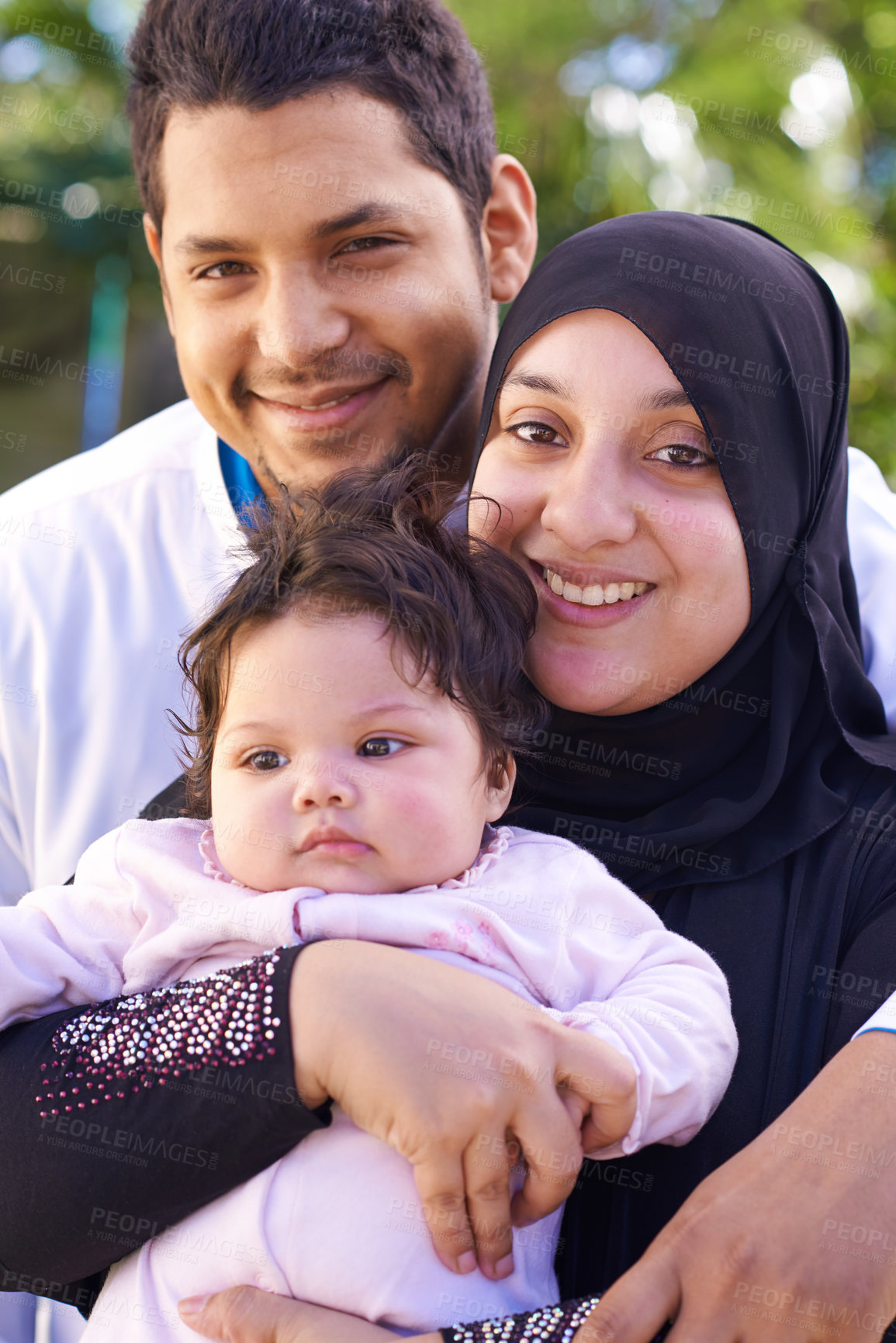 Buy stock photo Portrait of a muslim family enjoying a day outside