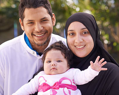 Buy stock photo Muslim family, park and portrait of parents with baby for bonding, smile and outdoors together. Islam, happy and mother, father and newborn infant for love, childcare or support in garden